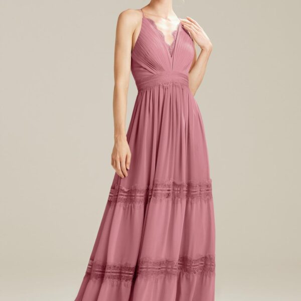for a design that almost has a boho-chic feel to it. Enjoy the uniqueness of the design while appreciating the plunging V-neck of the bodice. The spaghetti straps offer a barely-there look that you wil