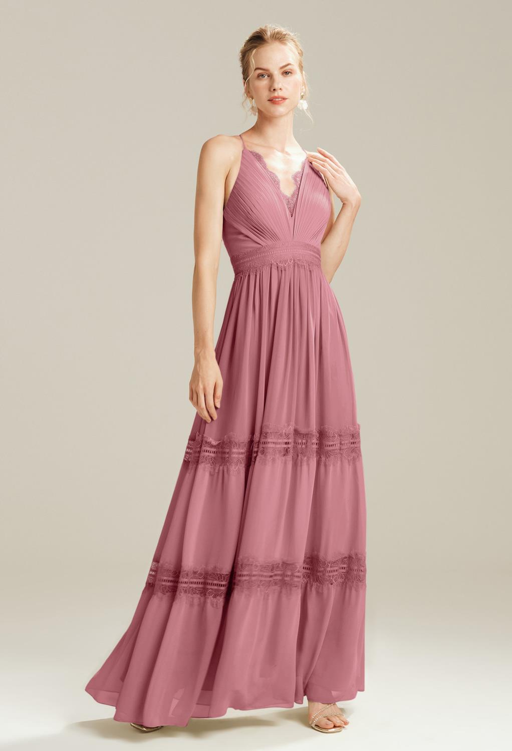 for a design that almost has a boho-chic feel to it. Enjoy the uniqueness of the design while appreciating the plunging V-neck of the bodice. The spaghetti straps offer a barely-there look that you wil