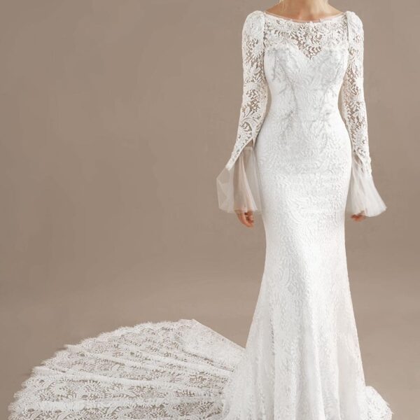 the Nikki dress features removable sleeves. The sleeves have beautiful applique embellishments. The lace train gathers beautifully around the bride