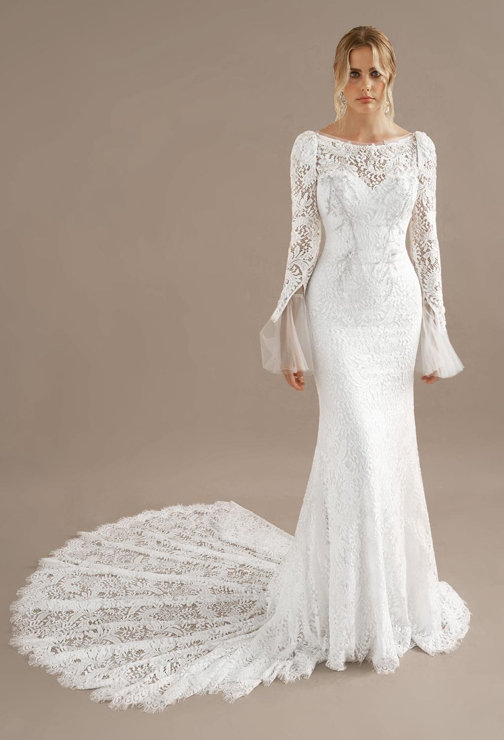 the Nikki dress features removable sleeves. The sleeves have beautiful applique embellishments. The lace train gathers beautifully around the bride
