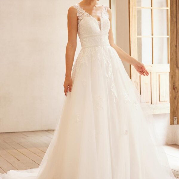 perfect for a bride thatu2019s unique & quiet. This A-line floor-length dress features a V-neck