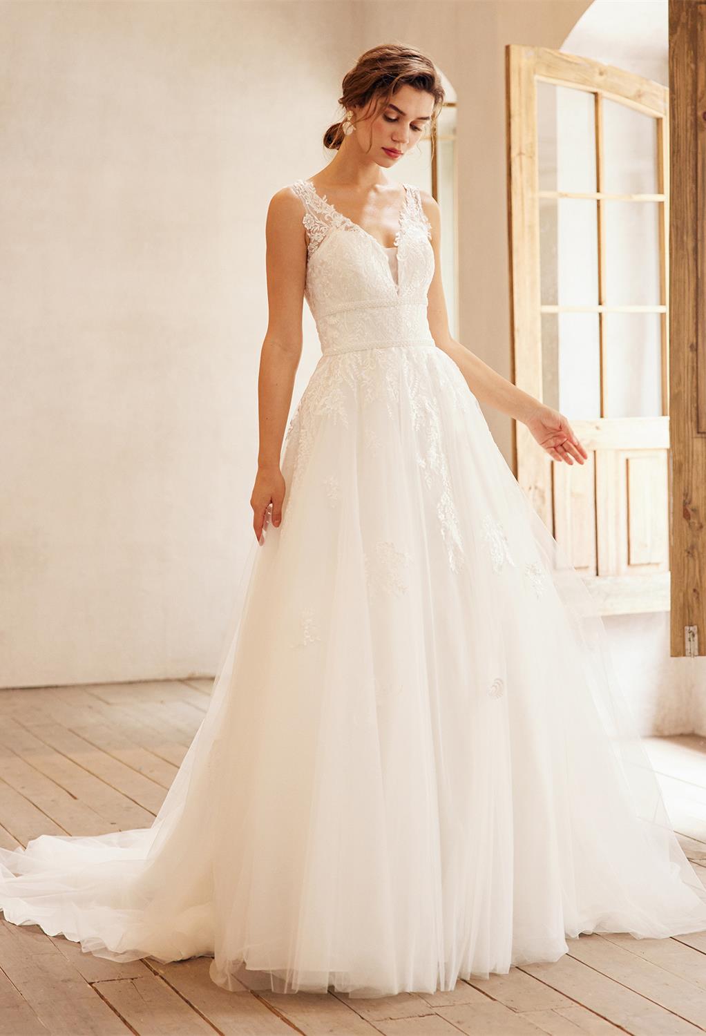 perfect for a bride thatu2019s unique & quiet. This A-line floor-length dress features a V-neck