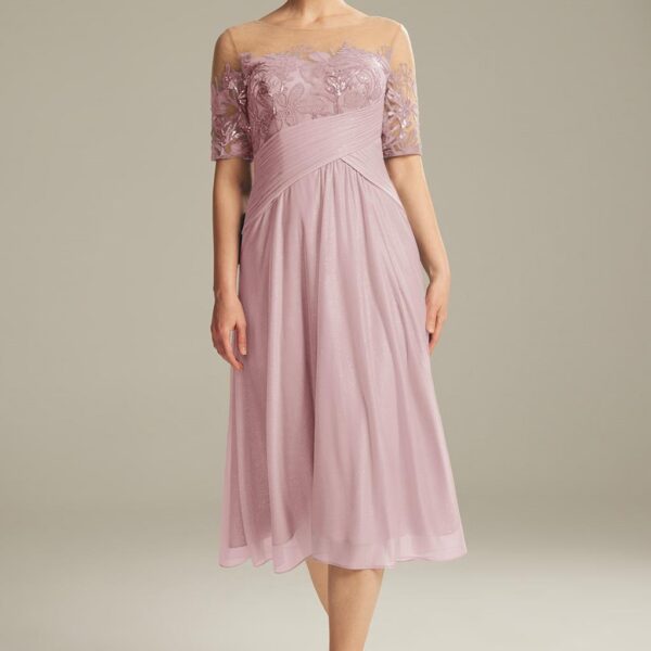 The Aw Sabella tea-length dress is a beautiful choice for the get to gather party. The dress is made of high-quality glitter mesh with a bateau neckline that gives the dress a defined outlook. The A-line body figure with the back zipper makes the dress ea