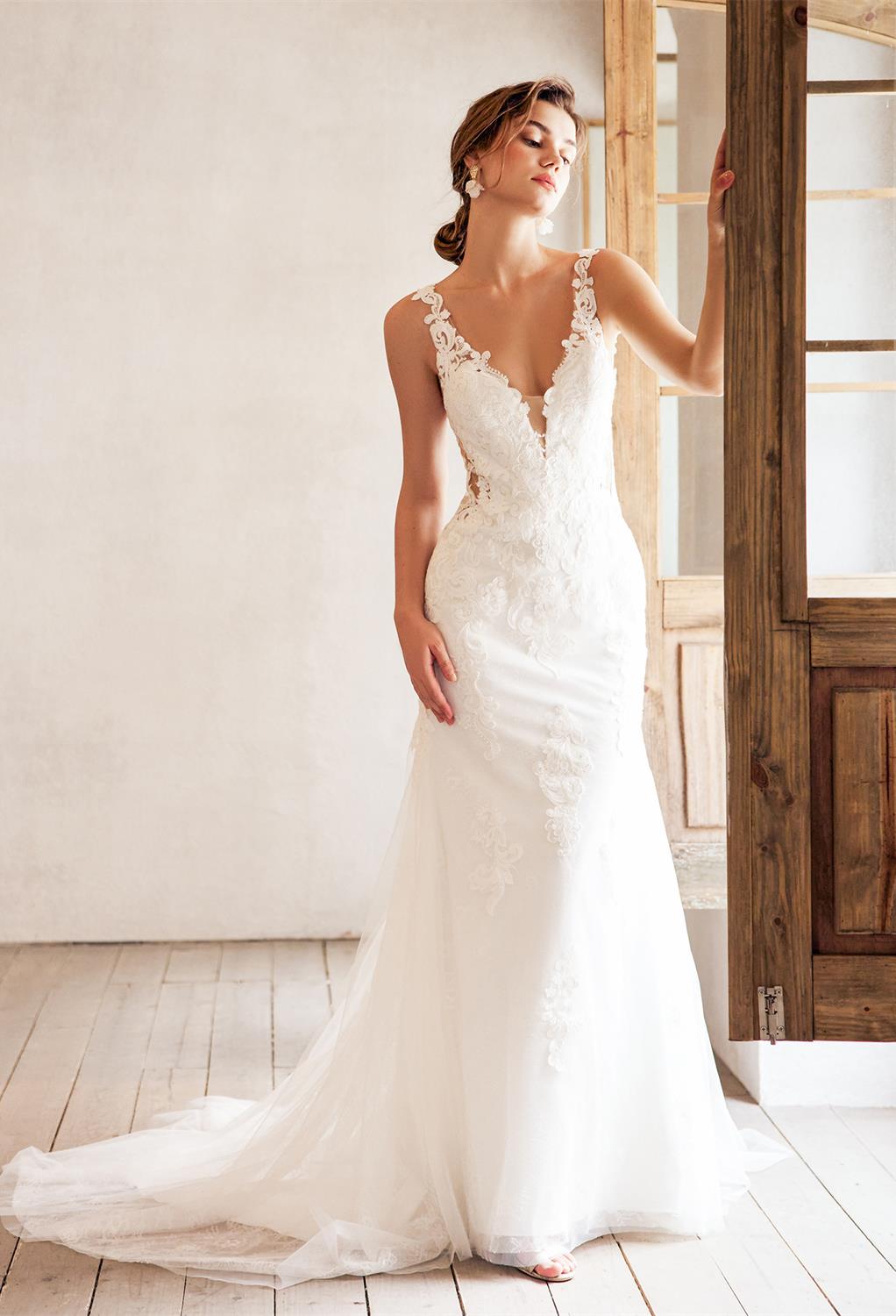 and the mermaid silhouette flatters the bride's figure.  Simona is sleeveless yet sheer strapped beauty wi