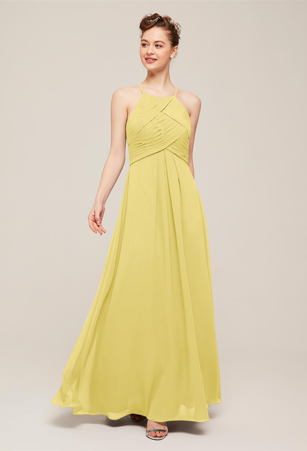 look to the Tammy bridesmaid dress. This long chiffon column gown stands out in a sea of strapless styles and sweetheart necklines. The front of the bodice consists of overlapping pleated swathes. Spaghetti straps meet