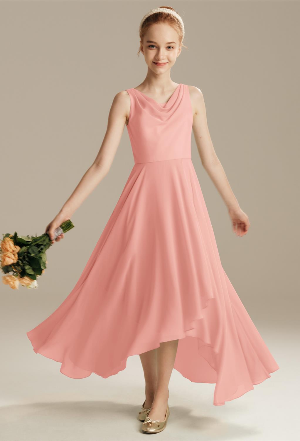 The Thermal dress is an ideal choice for the junior bridesmaid. The chiffon gown boasts an elegant jewel neckline that is flattering and sweet. The sleeveless look is perfect for those warm summer weddings. Enjoy how the flowing bodice makes way to a skir