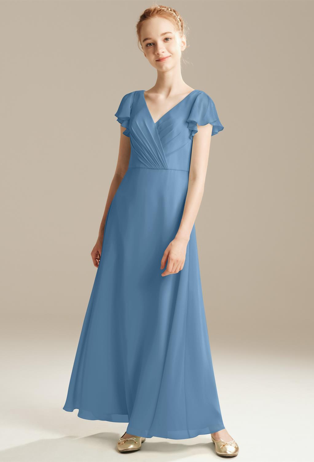 Beautiful butterfly sleeves make the Tyche dress the prettiest choice for your junior bridesmaid. The pleated V-neck of the dress is flattering and makes it easy to showcase a simple silver necklace. The floor length of the chiffon Tyche dress is graceful