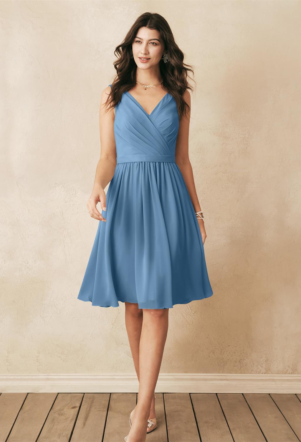 the Vivien dress offers a flirty charm that you'll adore. The plunging neckline and flattering bodice all you to look as elegant as you truly are. The pleated skirt of the dress offers great movement with every step that you
