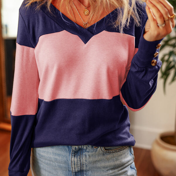 Add a stylish and slimming touch to your wardrobe with this long sleeve top. The V-neck design offers a sophisticated look while colorblocking adds a dynamic visual appeal. The button decor on the sleeves adds a twist of elegance. This top is sure to stan