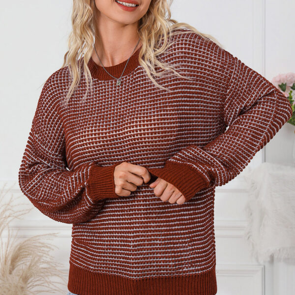 Cozy heathered knit for a stylish and comfortable lookTrendy drop shoulder design adds a relaxed and chic touchPuff sleeves create a feminine and fashionable silhouetteStay warm and fashionable with this must-have wardrobe staple Â