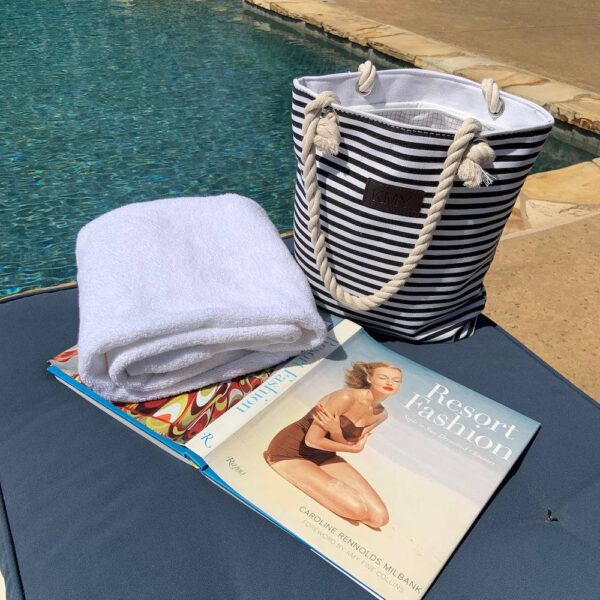 PRODUCT DESCRIPTIONThis striped tote bag is a chic way to keep all your essentials right at your fingertips. This trendy handbag is large enough to accommodate your cell phone