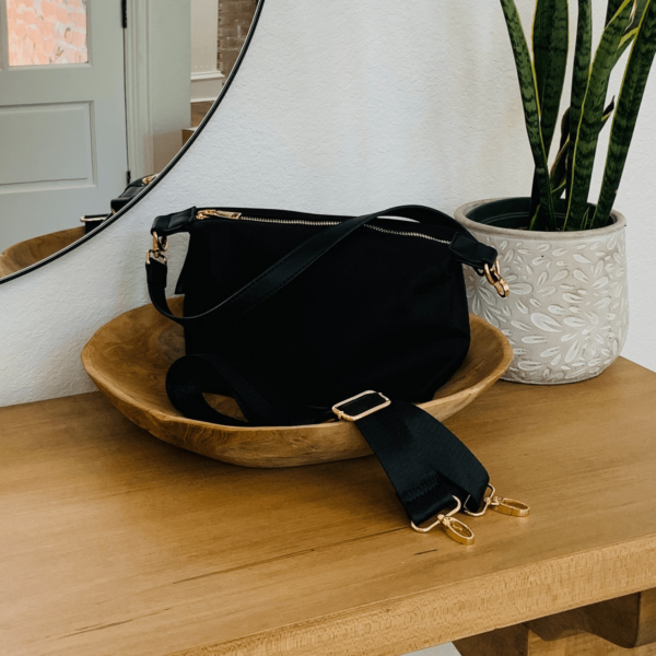 This adorable yet very functional nylon compact crossbody is the perfect  bag for your quick zips around town in style.This stunning bag features a space saving design perfect for your phone