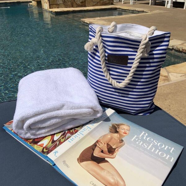 PRODUCT DESCRIPTIONThis striped tote bag is a chic way to keep all your essentials right at your fingertips. This trendy handbag is large enough to accommodate your cell phone