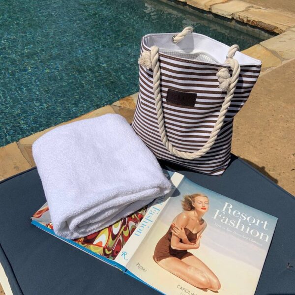 PRODUCT DESCRIPTIONThis striped tote bag is a chic way to keep all your essentials right at your fingertips. This trendy handbag is large enough to accommodate your cell phone