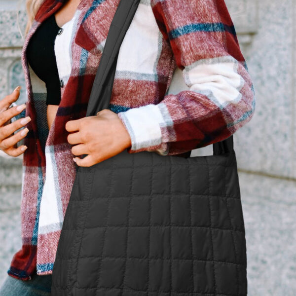 Add a touch of elegance to your look with the quilted design! This spacious tote (15x5x12 in) can easily hold all your essentials