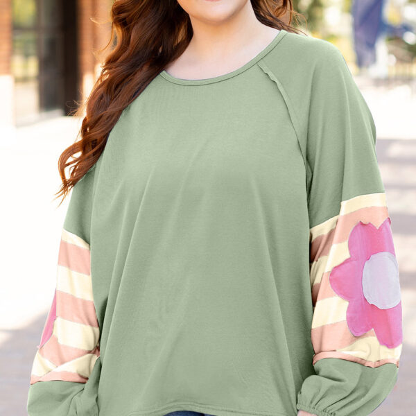 Be effortlessly stylish in this oversized pullover featuring a vintage-inspired mineral wash and playful bubble sleeves with elastic cuffs. With contrasting color stripes on the sleeves