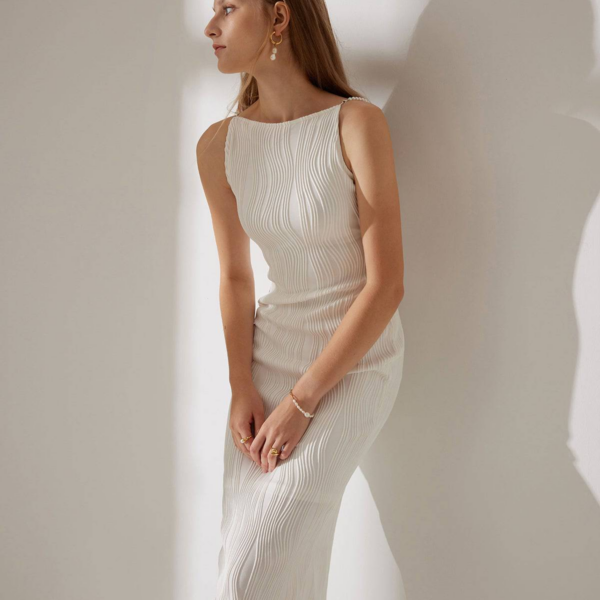 Fabric:This dress is made of Polyester and Elastane. Polyester is a man-made fiber that is soft