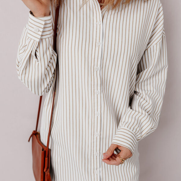 Elevate your style with this striped shirt dress - a timeless and chic choice. The classic button-up design adds versatility and polish to any look. Stay comfortable and on-trend with a sophisticated collared neckline and long sleeves for any season.