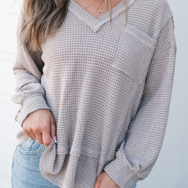 A comfortable waffle knit top for the new seasonIt features a v-neck