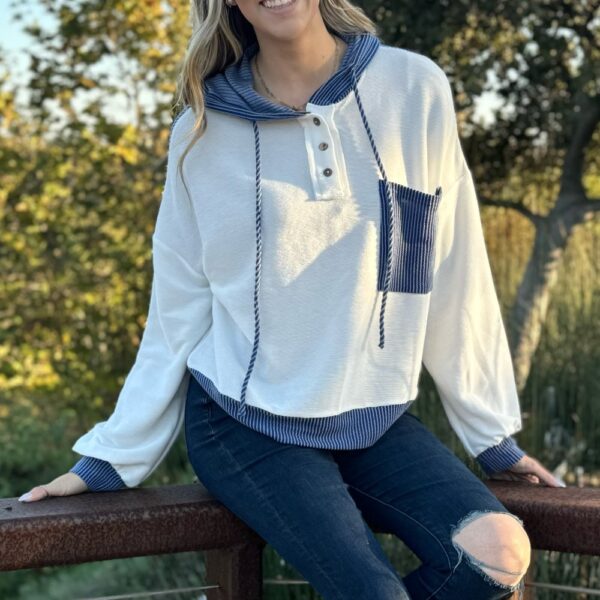 Get ready to be the talk of the town with our Millie Drawstring Hooded Top! This eye-catching pullover features a one-of-a-kind patchwork design and a textured fabric that will make you stand out from the crowd. The colorblock design adds an unexpected po