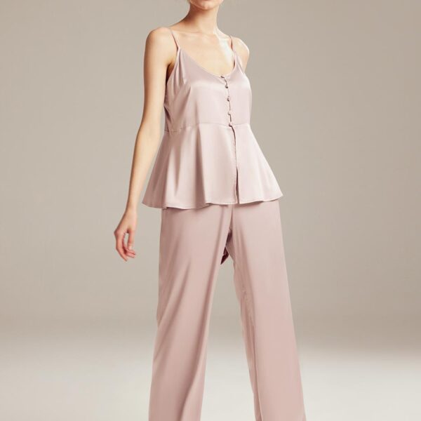 this set features a charming ruffle camisole and matching pants. Perfect for lounging or sleep
