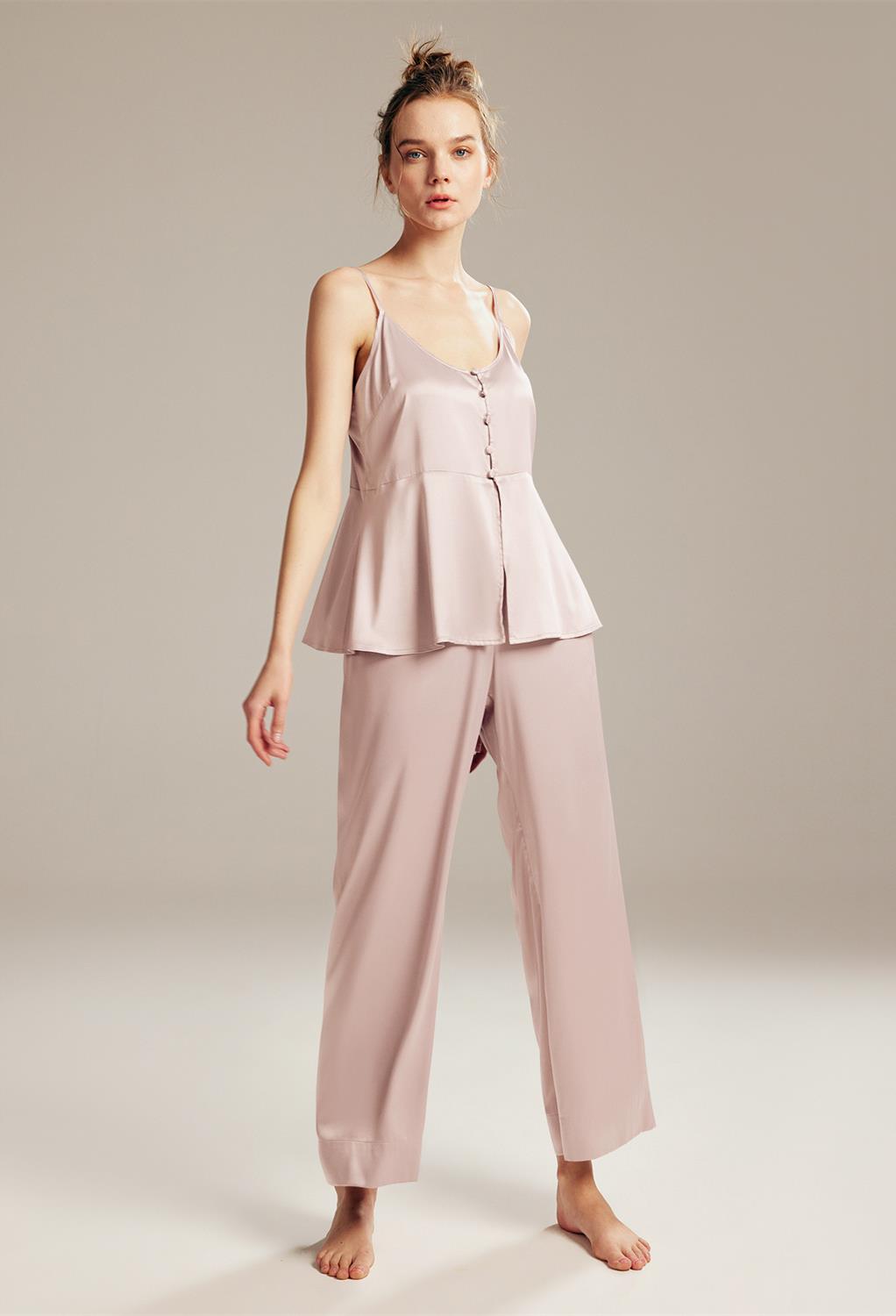 this set features a charming ruffle camisole and matching pants. Perfect for lounging or sleep