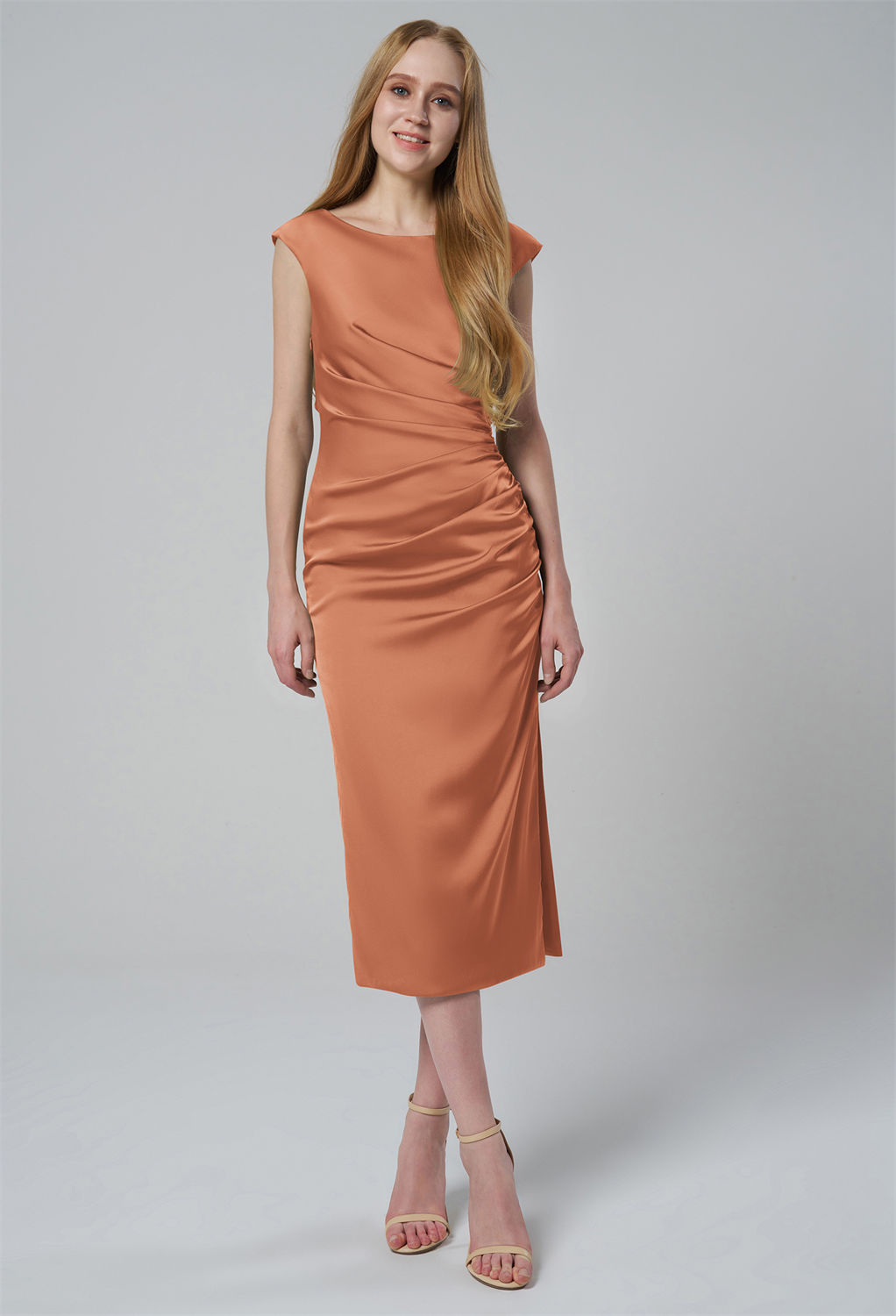while the subtle ruching along the side enhances the silhouette. Crafted from high-quality satin
