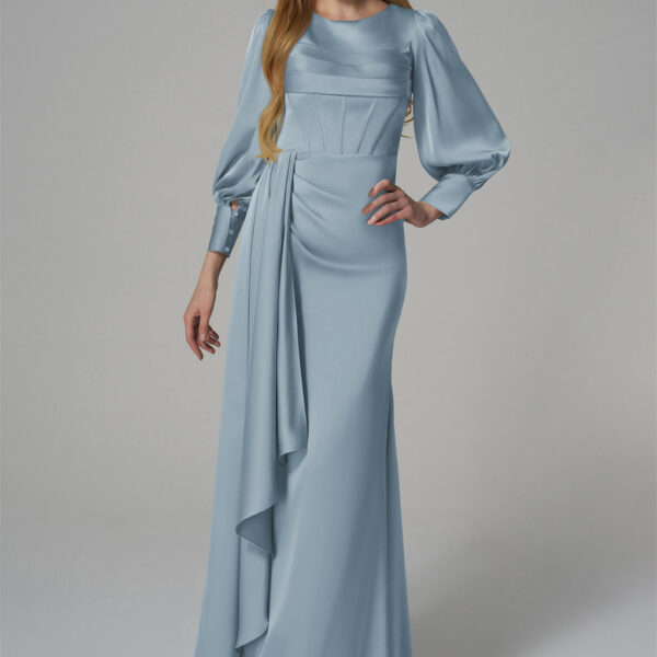 puffed sleeves and a fitted bodice with draped detailing at the waist. The floor-length skirt is complemented by a cascading side panel