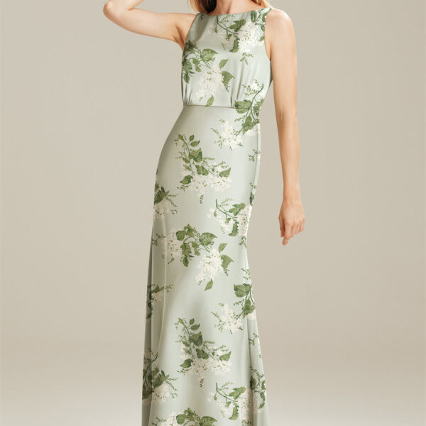 which is a great choice for ladies of all ages and body types. The back of the bodice plunges in a flirty way. Wear your hair up to show off the details of the gown. The mermaid fit of this