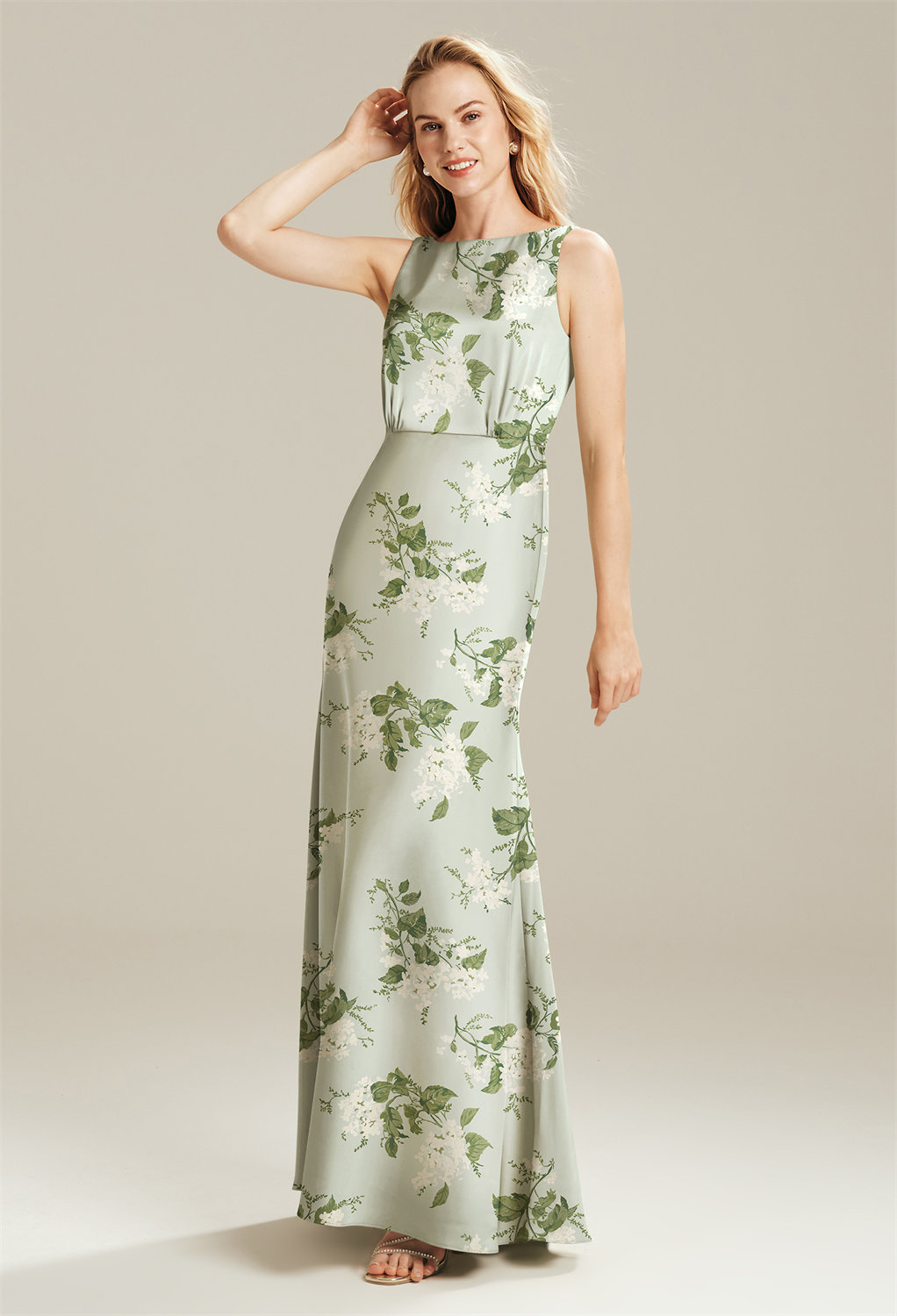 which is a great choice for ladies of all ages and body types. The back of the bodice plunges in a flirty way. Wear your hair up to show off the details of the gown. The mermaid fit of this