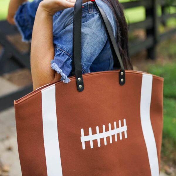 Get ready to score with this spacious Sport Canvas Tote! Show off your love for baseball or football with its vibrant pattern