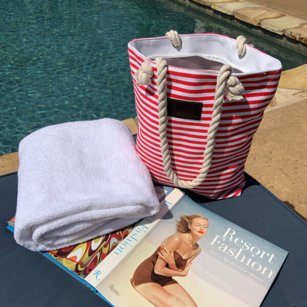 PRODUCT DESCRIPTIONThis striped tote bag is a chic way to keep all your essentials right at your fingertips. This trendy handbag is large enough to accommodate your cell phone