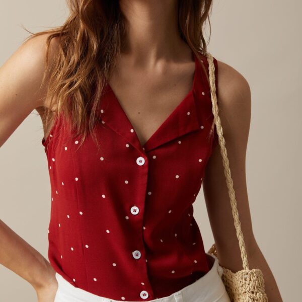 Details: - Tie- Lapel- V-Neck- Sleeveless- Polka Dot TopFabric:This Print Top is made of Polyester. Polyester is an artificial fiber that feels soft