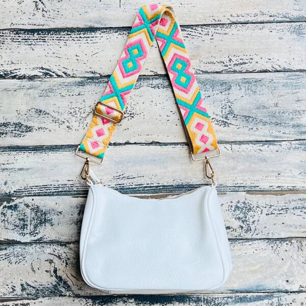 Now you can build your perfect bag! Pick your favorite color Lucy Handbag and then pick your favorite style strap to build the perfect bag. All straps are interchangeable!Our beautiful Vegan Leather handbag from the Threaded Pear is the perfect take any